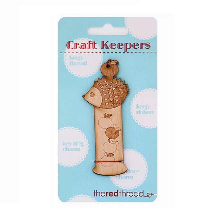 Wooden hedgehog shaped floss keeper.