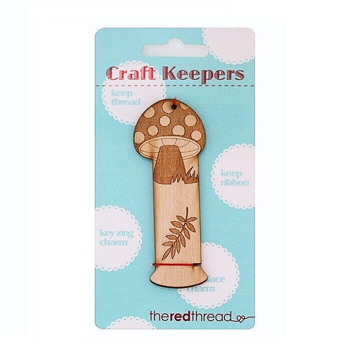 Wooden mushroom shaped floss keeper.