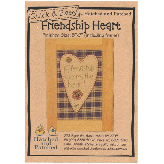 Pattern cover of wall hanging with friendship heart applique.