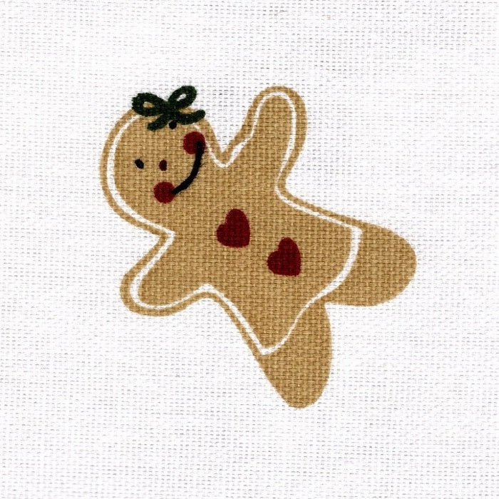 Smiling gingerbread girl cookie with red heart buttons.