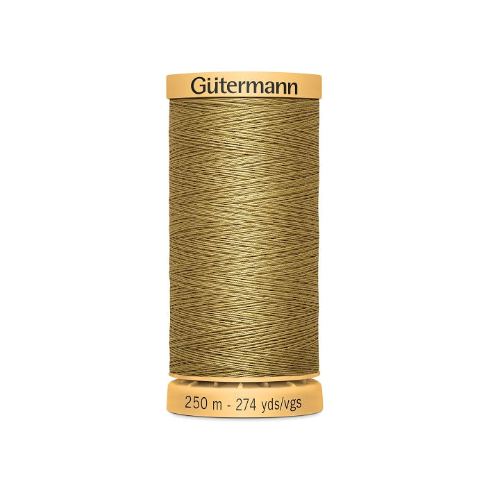 Spool of brown cotton thread with Gutermann branding.