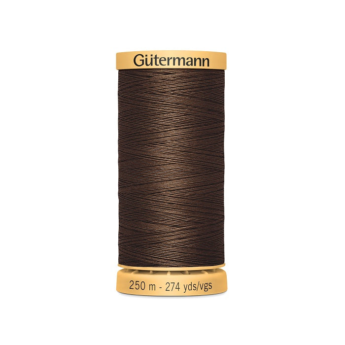 Spool of brown cotton thread with Gutermann branding.