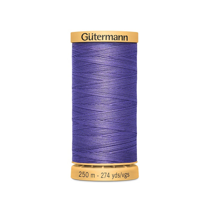 Spool of purple cotton thread with Gutermann branding.