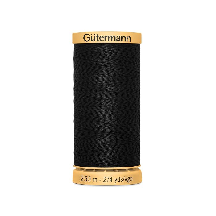 Spool of black cotton thread with Gutermann branding.