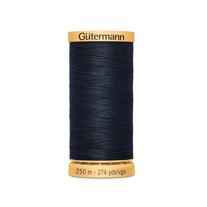 Spool of navy cotton thread with Gutermann branding.