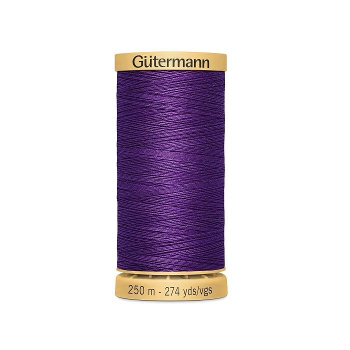 Spool of purple cotton thread with Gutermann branding.