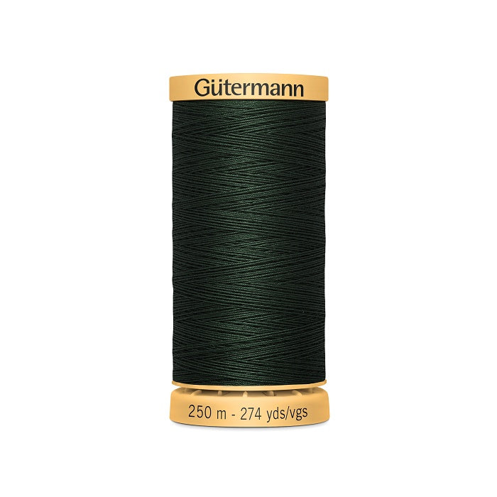Spool of very dark green cotton thread with Gutermann branding.