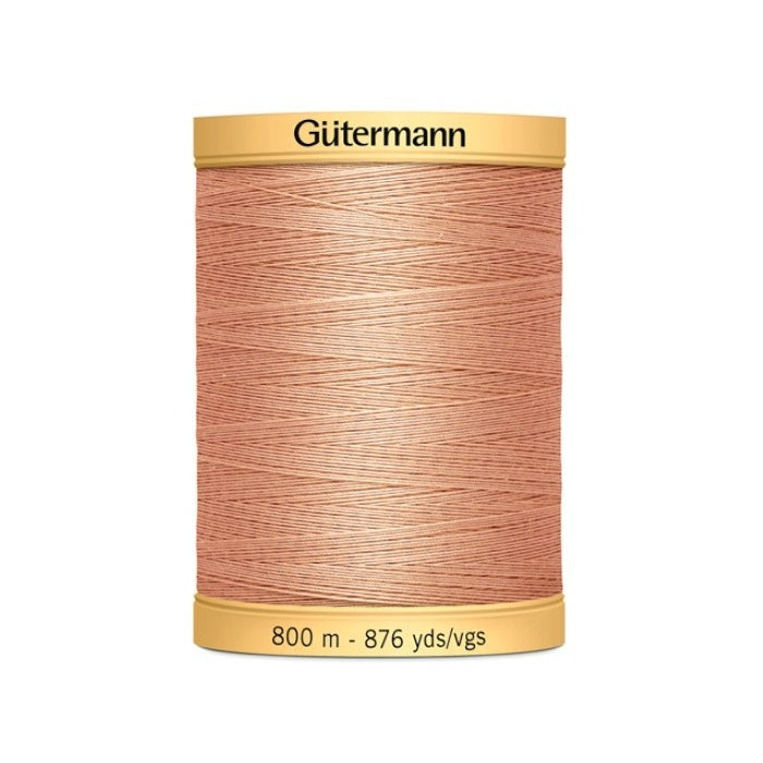 Spool of salmon pink thread with Gutermann 800m branding.