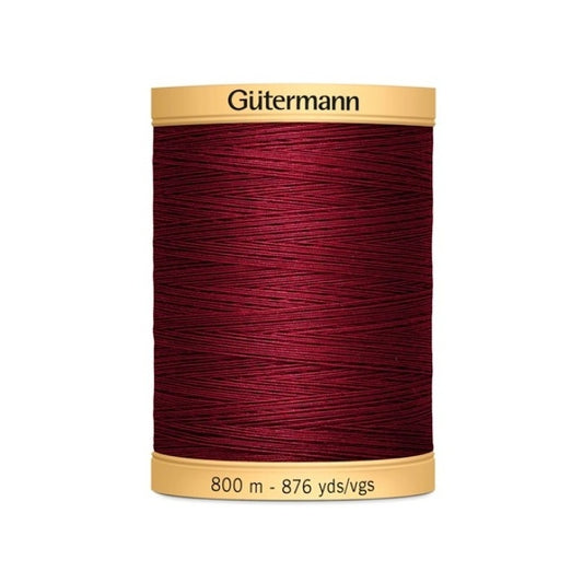 Spool of dark red thead with Gutermann  800m branding.