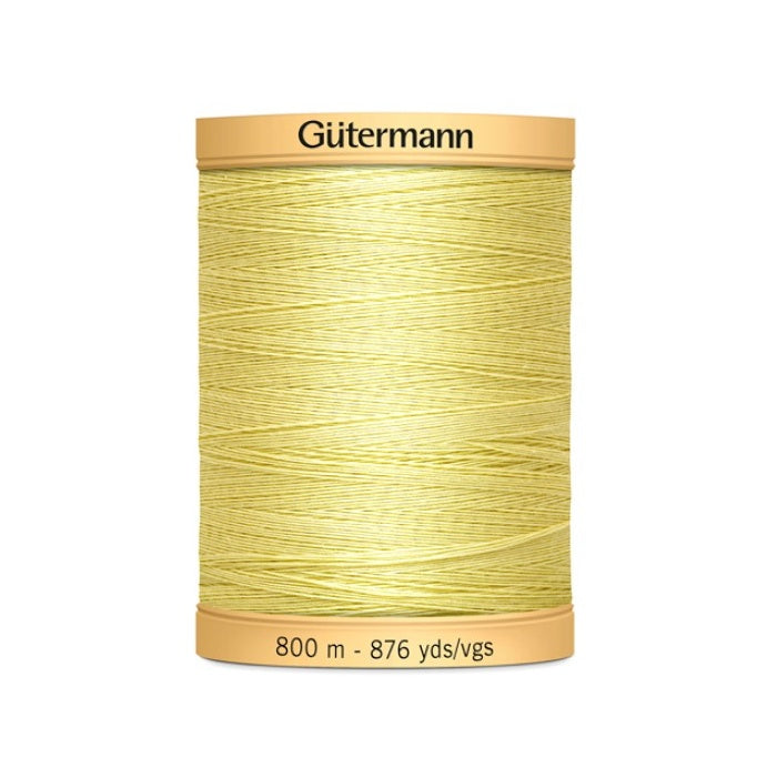 Spool of yellow thread with Gutermann 800m branding.