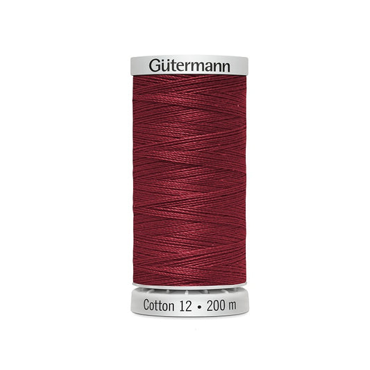 Spool of dark red thread with Gutermann Cotton 12 branding.