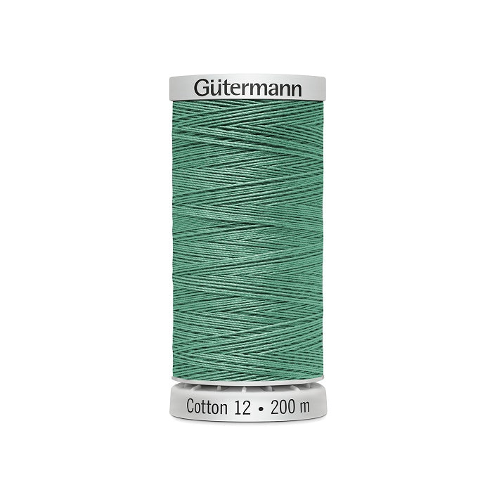 Spool of green thread with Gutermann Cotton 12 branding.