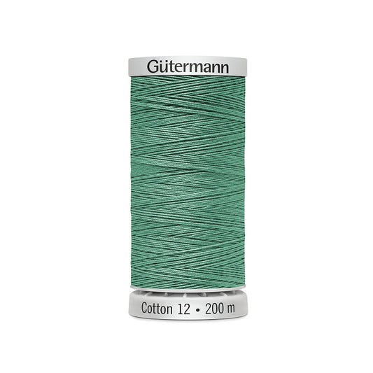 Spool of green thread with Gutermann Cotton 12 branding.