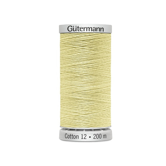 Spool of light yellow thread with Gutermann Cotton 12 branding.