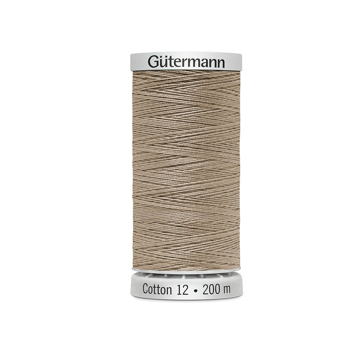 Spool of beige thread with Gutermann Cotton 12 branding.