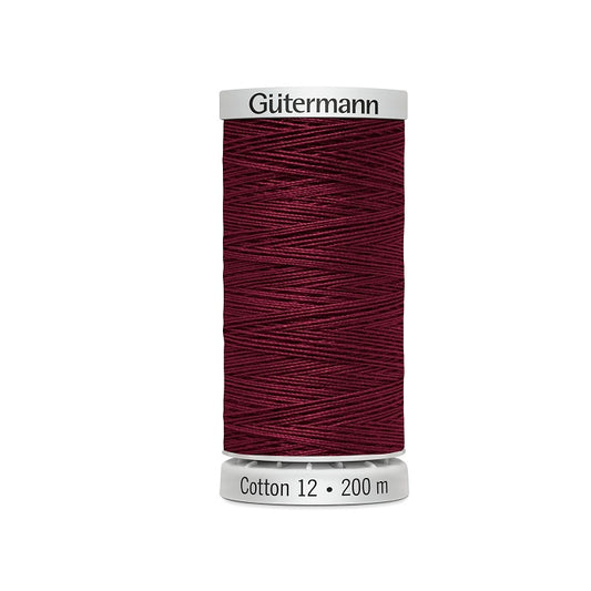 Spool of dark red thread with Gutermann Cotton 12 branding.