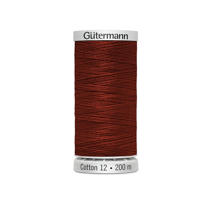 Spool of dark reddish brown thread with Gutermann Cotton 12 branding.