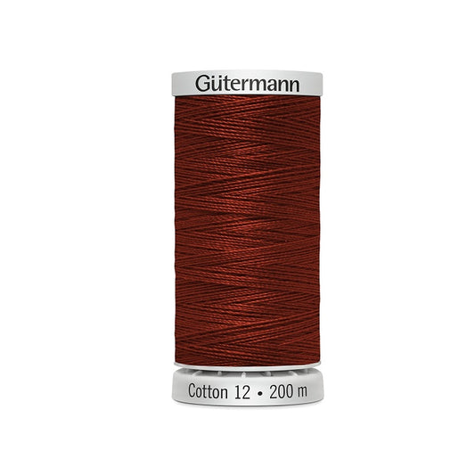 Spool of dark reddish brown thread with Gutermann Cotton 12 branding.