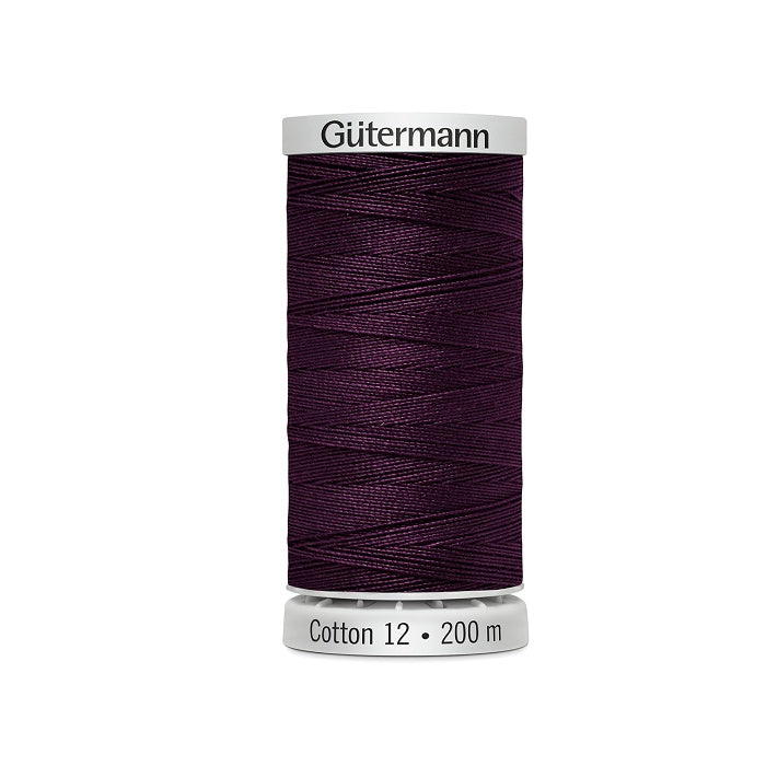 Spool of dark grape purple thread with Gutermann Cotton 12 branding.