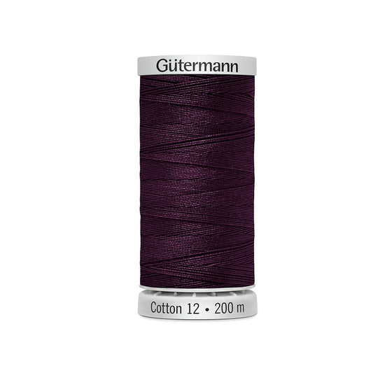 Spool of dark grape purple thread with Gutermann Cotton 12 branding.