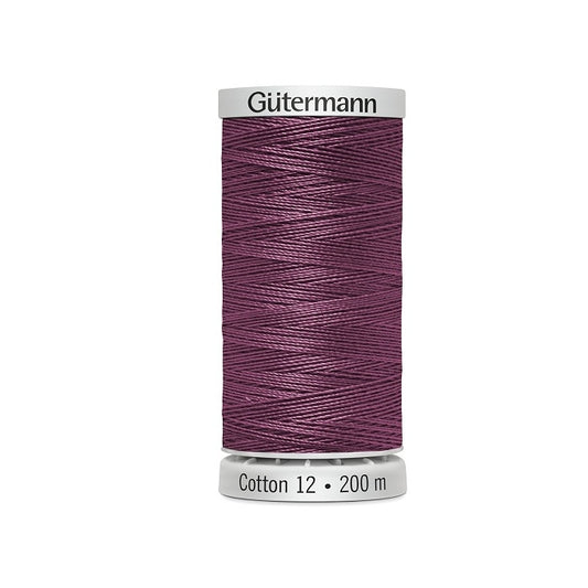 Spool of pinkish mauve thread with Gutermann Cotton 12 branding.