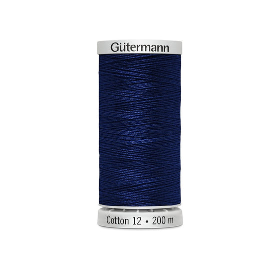 Spool of dark royal blue thread with Gutermann Cotton 12 branding.