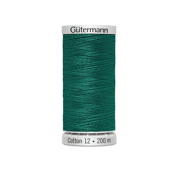 Spool of dark sea green thread with Gutermann Cotton 12 branding.