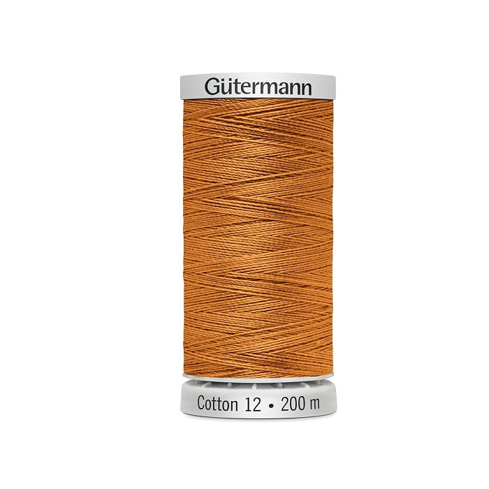 Spool of orange thread with Gutermann Cotton 12 branding.