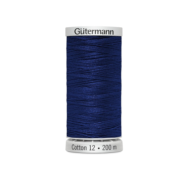 Spool of dark blue thread with Gutermann Cotton 12 branding.