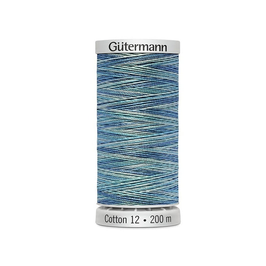Spool of blue variegated thread with Gutermann Cotton 12 branding.