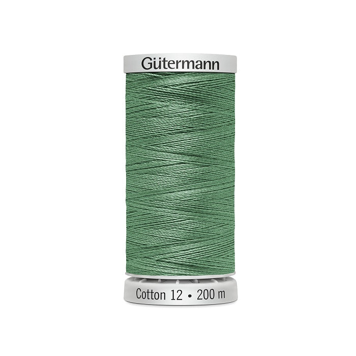 Spool of green thread with Gutermann Cotton 12 branding.