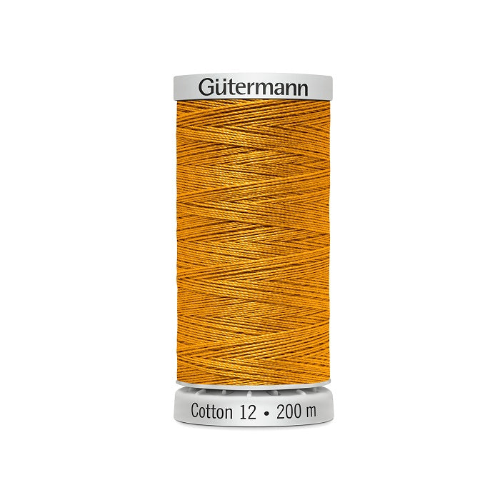 Spool of mustard yellow thread with Gutermann Cotton 12 branding.
