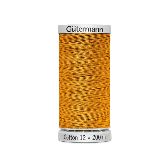 Spool of mustard yellow thread with Gutermann Cotton 12 branding.