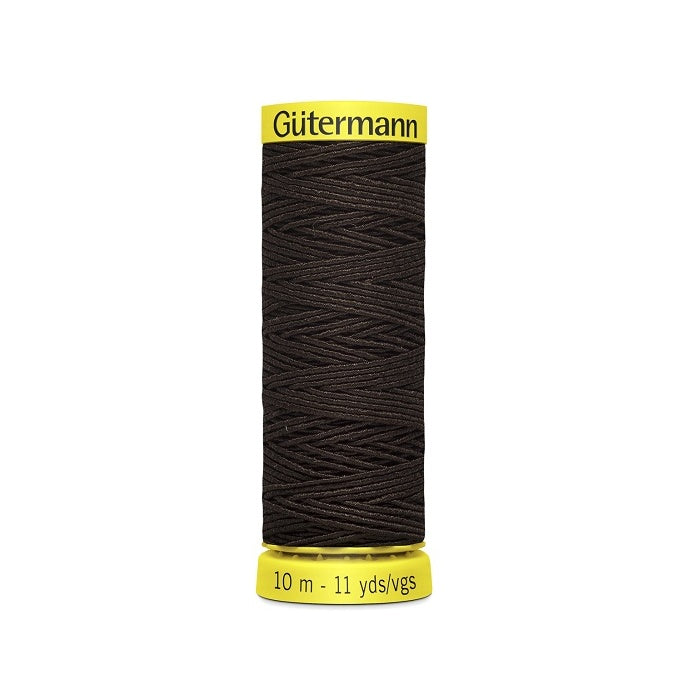 Dark brown elastic sewing thread spool with gutermann branding.