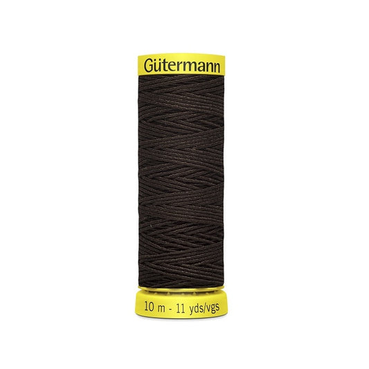 Dark brown elastic sewing thread spool with gutermann branding.