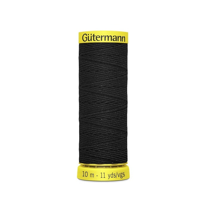 Black elastic sewing thread spool with gutermann branding.