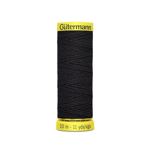 Navy elastic sewing thread spool with gutermann branding.