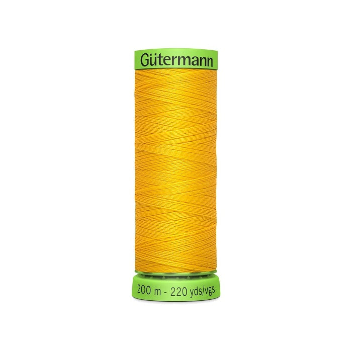 Spool of yellow extra fine thread with Gutermann branding.