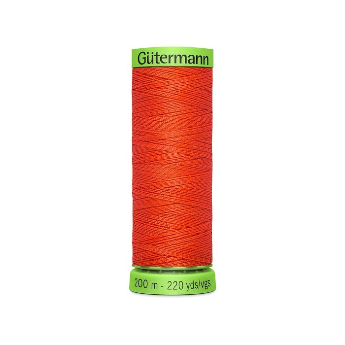Spool of dark orange extra fine thread with Gutermann branding.