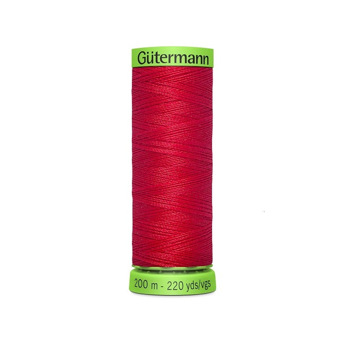 Spool of dark red extra fine thread with Gutermann branding.