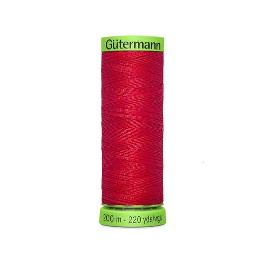 Spool of dark red extra fine thread with Gutermann branding.