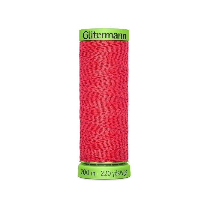 Spool of dark pink extra fine thread with Gutermann branding.