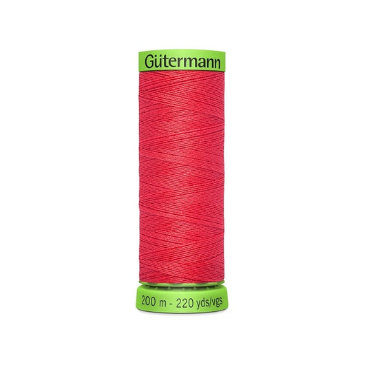 Spool of dark pink extra fine thread with Gutermann branding.
