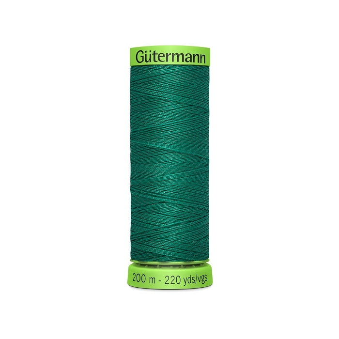 Spool of dark green extra fine thread with Gutermann branding.