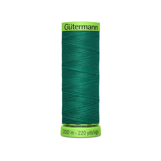 Spool of dark green extra fine thread with Gutermann branding.