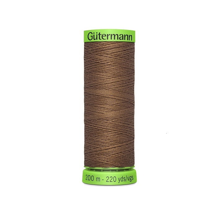 Spool of dark brown extra fine thread with Gutermann branding.