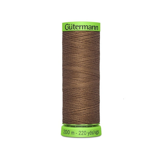 Spool of dark brown extra fine thread with Gutermann branding.
