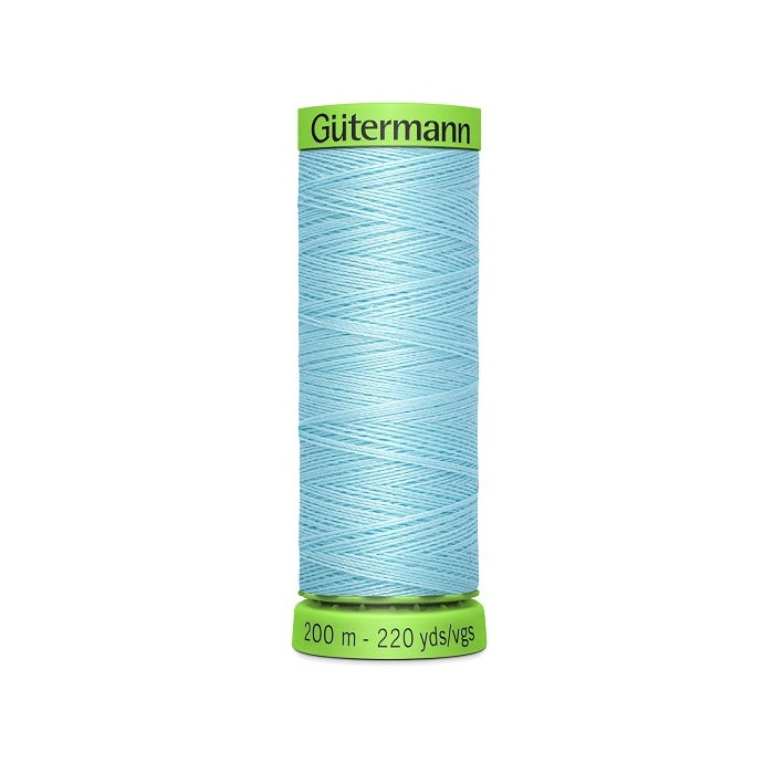 Spool of light blue extra fine thread with Gutermann branding.