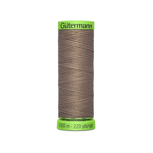 Spool of brown extra fine thread with Gutermann branding.