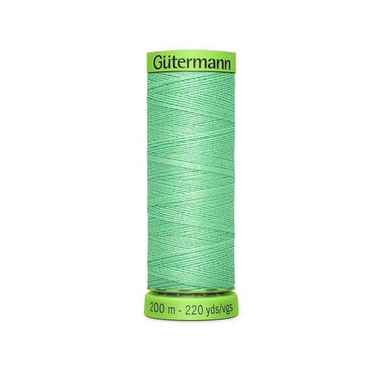 Spool of light green extra fine thread with Gutermann branding.